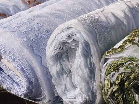 Rolls of colorful fabrics for tailoring of curtains and dresses