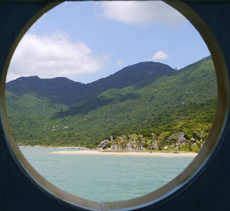 Beautiful round landscape, view through the window from the seaの写真素材