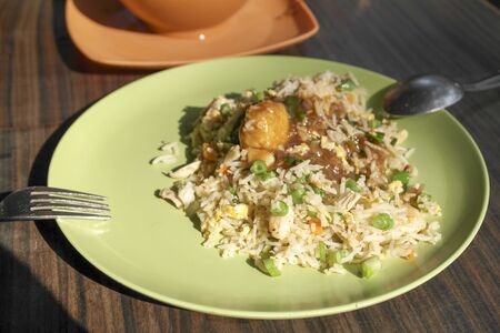 Thai food - rice with meat, vegetables and sauceの写真素材