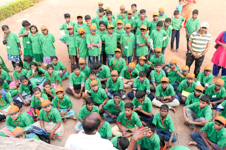 Badami, Karnataka, India - December 14, 2017: Indian schoolchildren and teachers take a tour of ancient temples.のeditorial素材