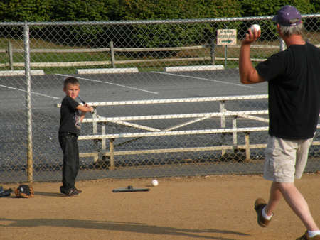 Father and son playing baseballの写真素材