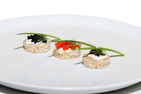 Black and red caviar on plate with onion and dillの写真素材