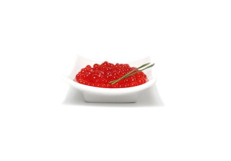 Red caviar with spring onion on plateの写真素材