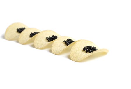 Black caviar  on potato chipsの写真素材