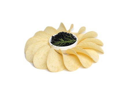 Black caviar in plate and potato chip の写真素材