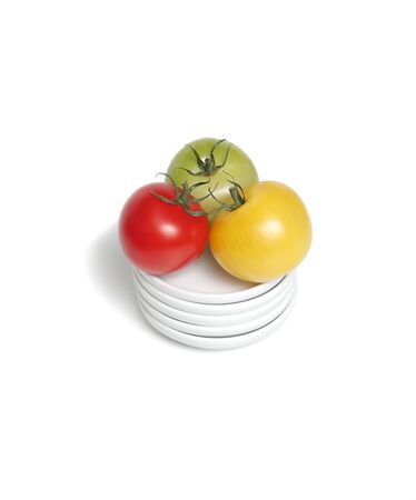 Colorful organic  tomatoes on platesの写真素材
