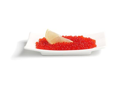 Red caviar and slice of lemon の写真素材
