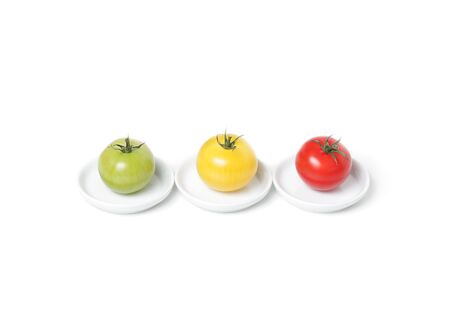 Colorful organic  tomatoes on platesの写真素材