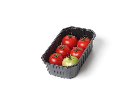 Organic red tomatoes in food containerの写真素材