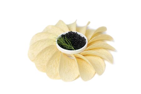 Black caviar with dill and potato chip の写真素材
