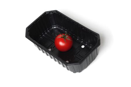 Organic red tomato in food containerの写真素材