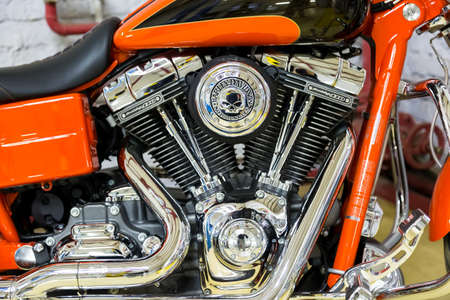 Moscow. November 2018. Orange Harley Davidson stands in the garage.twin cam screamin eagle 110...