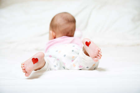 Parrents love concept. feet on footの写真素材