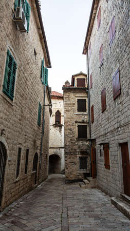 Beautiful narrow streets of the old European city. stone paved paths.の写真素材