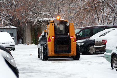Special snow removal equipment left for snow removal in winter. Heavy snowfall in the city, people...