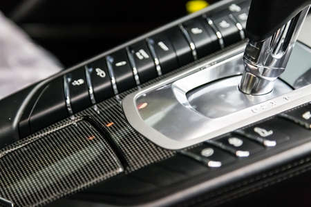 carbon panel around the gearbox. Aluminum button panel with chrome. Interior luxury sports carの写真素材