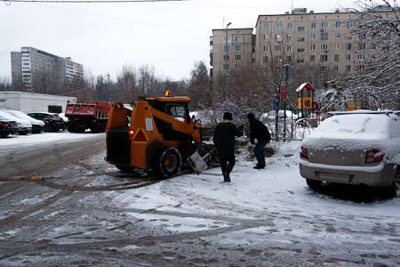 In the city of winter. Snow. All forces are thrown on snow removal. Special snowplows went to the streets to work. Problems of snow removal.の写真素材