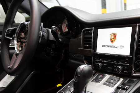 Moscow. November 2018. Removed from steering wheel airbag. Porsche Panamera repair works, examining in service center. Disassembled car interior with carbon panelsのeditorial素材