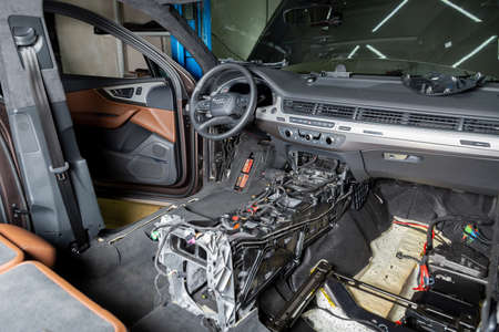 Moscow. November 2018. Audi car repair service center. Dismantled car interior. Check car wiring. Removed chairs, floor trim. leather interior premium crossover. Gearbox repairのeditorial素材