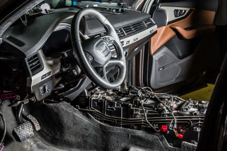 Moscow. November 2018. Audi car repair service center. Dismantled car interior. Check car wiring. Removed chairs, floor trim. leather interior premium crossover. Gearbox repairのeditorial素材