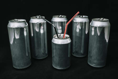 Inequality and injustice. Big aluminium cans around small can. Boss with bodyguards concept. Main man on rest. equality of peopleの写真素材