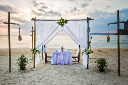 Romantic dinner table on the beachの写真素材