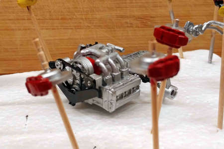 Modeling. Build a scale model of a car. Plastic parts of the car are painted, waiting for instal....