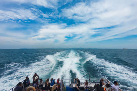 Railay, Thailand May 12, 2019: Passenger speedboat, steam, sailing forward leaving behind a trail on...