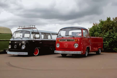 Moscow. Russia - May 20, 2019: Red and black legendary Volkswagen transporter T2 are parked on the...