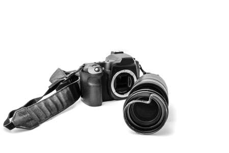 Broken digital SLR camera, dented protective filter on the zoom lens. Will be repaired. Isolated on...