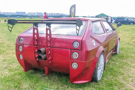 Moscow, Russia - May 25, 2019: Lada hatchback red color in exclusive tuning. Huge aerodynamic...