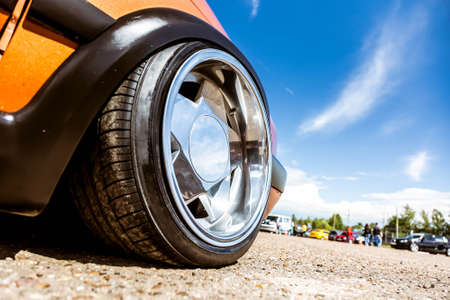 Mirror polished tuned wheels mounted on an understated orange car. Exclusive forged wheels on the...
