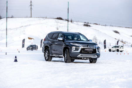 Moscow, Russia - February 17, 2021: All new Mitsubishi Pajero Sport. Facelifted suv. winter, the car is tested at the test site the front of the updated SUV. Front and half viewのeditorial素材