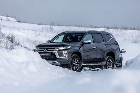 Moscow, Russia - February 17, 2021: All new Mitsubishi Pajero Sport. Facelifted suv. winter, the car is driving off-road. the front of the updated SUV.のeditorial素材