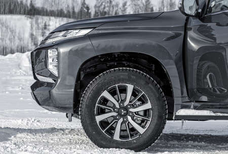 Moscow, Russia - February 17, 2021: All new Mitsubishi Pajero Sport. Details. Closeup of LED headlights, bumper, hood, radiator grill, taillights, side fenders, mirrors.のeditorial素材