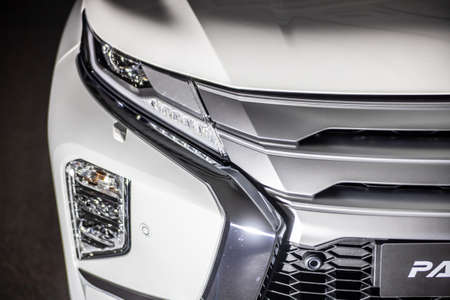 Moscow, Russia - February 17, 2021: All new Mitsubishi Pajero Sport. Details. Closeup of LED headlights, bumper, hood, radiator grill, taillights, side fenders, mirrors.のeditorial素材