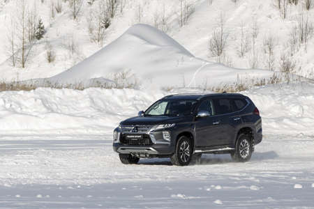 Moscow, Russia - February 17, 2021: All new Mitsubishi Pajero Sport. Facelifted suv. winter, the car is tested at the test site the front of the updated SUV. Front and half viewのeditorial素材