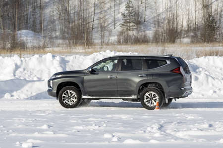 Moscow, Russia - February 17, 2021: All new Mitsubishi Pajero Sport. Facelifted suv. winter, the car is tested at the test site the front of the updated SUV. Front and half viewのeditorial素材