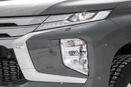 The LED headlights and LED fog lights on the SUV are gray.の写真素材
