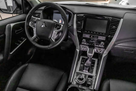 Moscow, Russia - February 17, 2021: All new Mitsubishi Pajero Sport. Montero. Car stand at the parking box, dark light.のeditorial素材