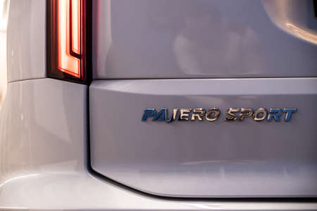 Moscow, Russia - February 17, 2021: All new Mitsubishi Pajero Sport. Montero. Car stand at the parking box, dark light.のeditorial素材
