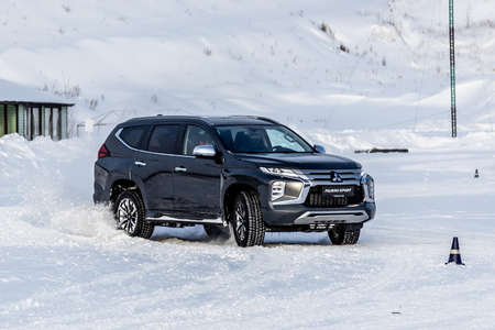 Moscow, Russia - February 17, 2021: All new Mitsubishi Pajero Sport. Montero. Car stand at the parking box, dark light.のeditorial素材