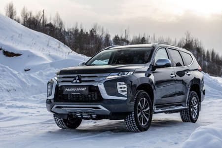 Moscow, Russia - February 17, 2021: All new Mitsubishi Pajero Sport. Montero. Car stand at the parking box, dark light.のeditorial素材