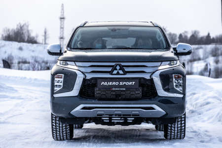 Moscow, Russia - February 17, 2021: All new Mitsubishi Pajero Sport. Montero. Car stand at the parking box, dark light.のeditorial素材