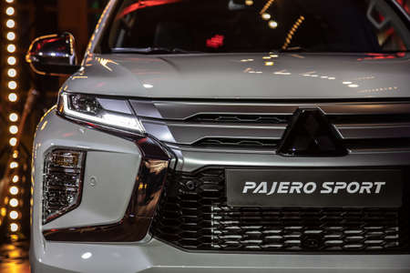 Moscow, Russia - February 17, 2021: All new Mitsubishi Pajero Sport. Montero. Car stand at the parking box, dark light.のeditorial素材