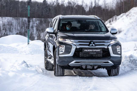 Moscow, Russia - February 17, 2021: All new Mitsubishi Pajero Sport. Details. Closeup of LED headlights, bumper, hood, radiator grill, taillights, side fenders, mirrors.のeditorial素材