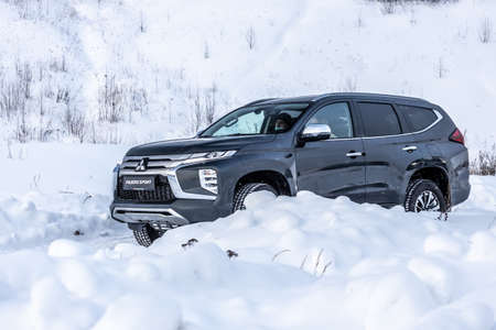 Moscow, Russia - February 17, 2021: All new Mitsubishi Pajero Sport. Montero. Car stand at the parking box, dark light.のeditorial素材