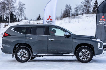 Moscow, Russia - February 17, 2021: All new Mitsubishi Pajero Sport. Montero. Car stand at the parking box, dark light.のeditorial素材