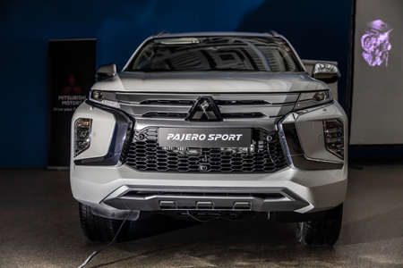 Moscow, Russia - February 17, 2021: All new Mitsubishi Pajero Sport. Montero. Car stand at the parking box, dark light.のeditorial素材