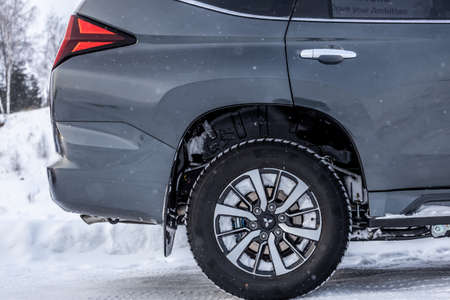 Moscow, Russia - February 17, 2021: All new Mitsubishi Pajero Sport. Details. Closeup of LED headlights, bumper, hood, radiator grill, taillights, side fenders, mirrors.のeditorial素材